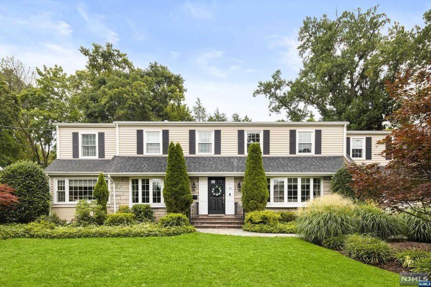 Stunning Center Hall Colonial in Tenafly's most sought-after East Hill section. First floor boasts, entry foyer, large living room, formal dining room, modern eat in kitchen w/granite counter tops, high end appliances and radiant heat, family room w/gas fireplace off kitchen w/sliders to backyard, powder room, laundry room and mud room. Second floor features primary bedroom suite w/2 walk in closets, fireplace, and full bathroom with soaking tub, 3 additional bedrooms, 2 full baths and office. The basement is finished with rec room and kitchenette. The backyard is park-like and secluded with plenty of space for entertaining. Just minutes away from NYC and access to a superb school system.