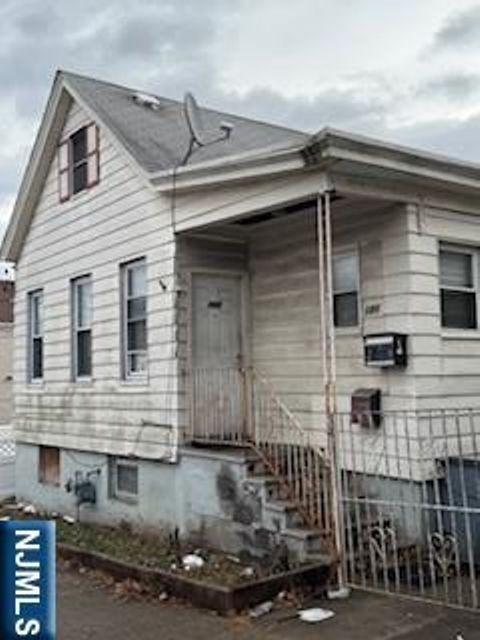 Photo of 1131 Main St #House, Paterson, NJ 07503 (MLS # 26000887)