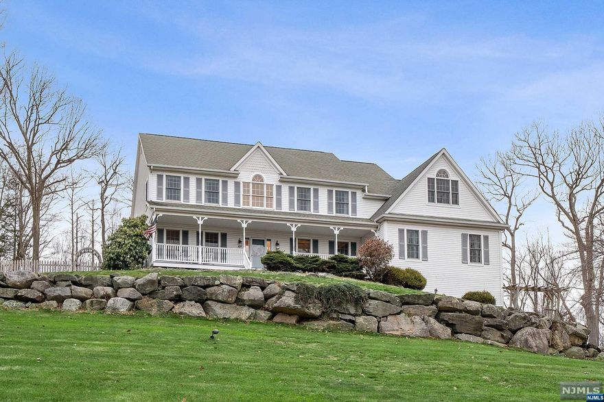 Spectacular and Spacious Colonial. Approximately 4200 sq. ft. of Luxury Living. This home offers 5 bedrooms and 3.5 baths set on 2.02 acres on a cut de sac. This home sits high on the hill over looking the Appalachian Mountains. Walk into the grand foyer to an open floor plan. Above is a balcony over looking the Grand Foyer. You will find a Media Room, an Office which flows into the Great Room, with a floor to ceiling stone fireplace, yet can all be separated by privacy doors. Follow me through to the large Country Eat In Kitchen with a Center Island that seats 4 with a range that faces your guests. There is a Formal Dining Room, In-law or Guest Suite which has a LR/Kitchen, Master Bedroom w/Private Bath. Private entry from the front porch. A screened in porch and a deck that leads to the Luxury heated Gunite Pool w/ Waterfalls and Perennial Gardens all fenced in. 2nd floor Master Bedroom w/Private Bath and 2 lg. walk in closets. There are 3 additional bedrooms with a full bath.