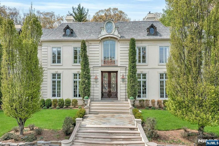 Why Travel to France when timeless French elegance can be yours every day? Welcome to an over 6000 sq ft masterpiece that brings the romance, refinement and artistry of French design to your doorstep. From the moment you arrive, this home evokes the charm of a countryside chateau blended seamlessly w modern luxury living. Architectural details include arched doorways, intricate millwork, and sun-drenched interiors from floor to ceiling windows create an atmosphere of sophistication. Every room tells a story: from the grand yet intimate living spaces to serene bedrooms that feel like a retreat. Tucked away on a cul de sac, built by a renowned local builder, This home is a lifestyle Where everyday feels like a getaway and the essence of France is your reality.
