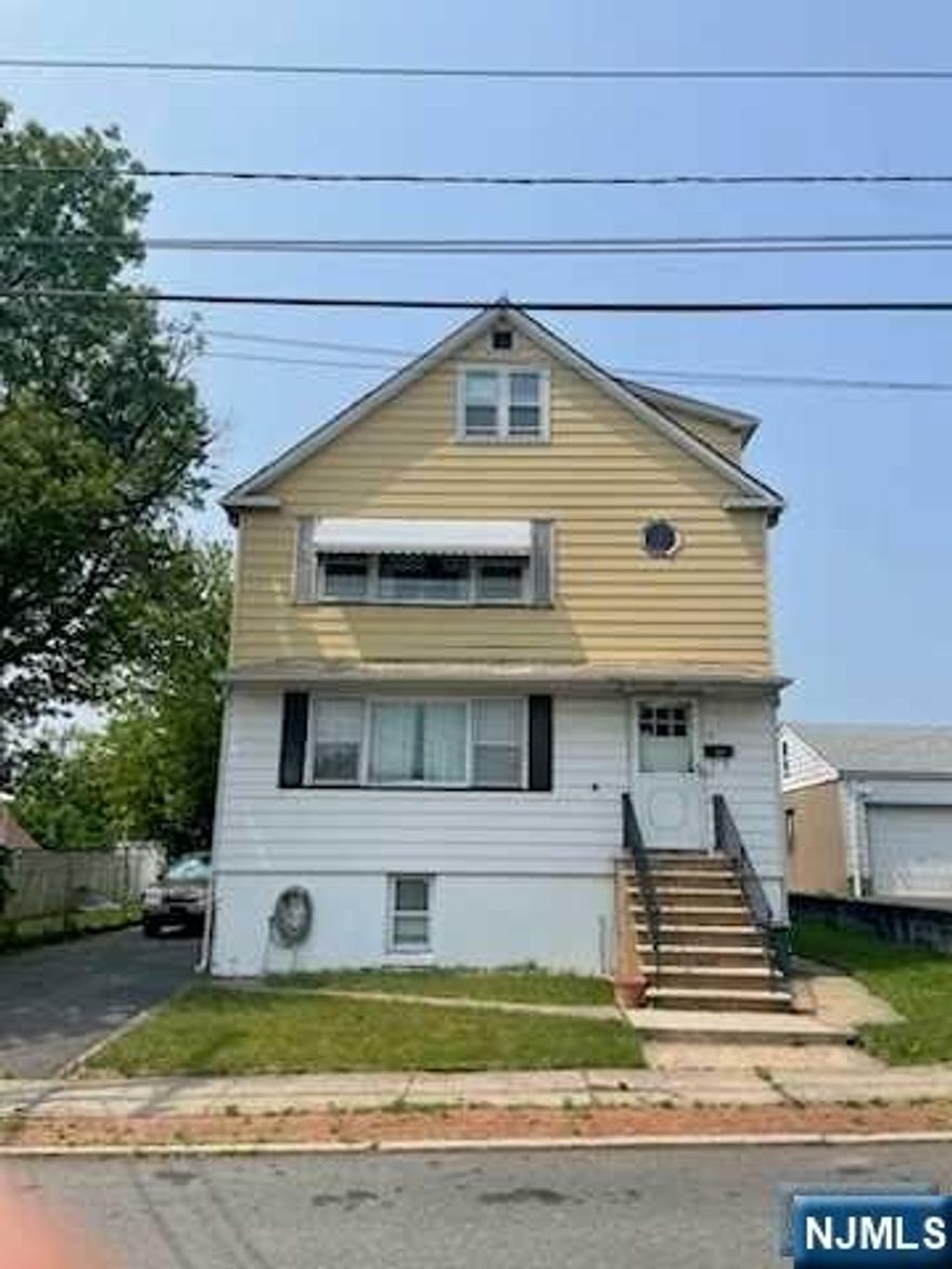 Two family home in Elmwood Park conveniently located near NYC transportation, major highways, schools and shopping! The first floor unit offers living room, formal dining room and the eat-in kitchen offers plenty of cabinetry storage and counter space for all of your kitchen needs. 2 bedrooms and full bathroom complete the first floor. The second floor unit is identical to the first floor including living room, dining room, eat-in kitchen, 2 bedrooms and a full bathroom. The third floor is a walk up unfinished attic that is the perfect space for extra storage. The partially finished basement offers the possibility of extra living space with a small kitchenette and living room with a walk out to the backyard. Backyard is totally level and quite spacious. This home offers public water, 2 gas meters, 2 (Fed Pacific) electrical panels. There is a below ground oil tank for the heating system with cast iron heat. Utilities and laundry room are also located in the basement.