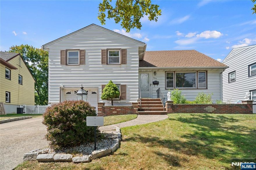 Beautifully updated and freshly painted 3-bedroom, 2-bath split-level home, ideally located in one of Clifton's most desirable neighborhoods. With a thoughtful layout and modern finishes throughout, this home offers the perfect blend of comfort, function, and style.The sunlit dining room is perfect for gatherings and flows seamlessly into the living room with refinished hardwood floors and recessed lighting. The renovated kitchen features sleek cabinetry, updated appliances, and contemporary finishes that make cooking and entertaining a pleasure.The private primary bedroom enjoys its own level creating a peaceful retreat you'll love. Ground level and large basement offer endless flexibility: media room, gym, office, or playroom your choice.Step outside to a fully fenced backyard ideal for relaxing or entertaining and enjoy the added convenience of an attached garage and driveway parking.Newer roof, furnace, HTW, refinished hardwood floors, recessed lighting and much more. Located near schools, parks, houses of worship, shopping, and major highways with easy access to NYC transportation.