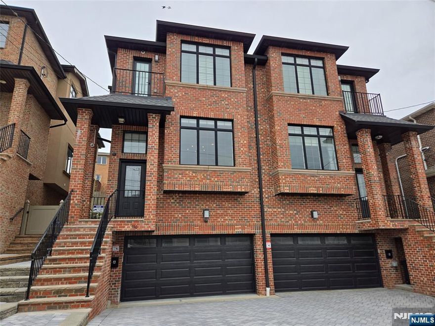 Duplex home, recently constructed and beautifully built by a prominent builder, offering approximately 2,800 sq ft of living space. Features include 10-foot ceilings in the living and dining rooms and 9-foot ceilings throughout the rest of the home. The gourmet eat-in kitchen boasts custom cabinetry, top-of-the-line finishes, and a stone fireplace, along with a convenient powder room on the main level. The second floor offers a stunning primary suite with great views, along with a spa-like primary bath featuring a state-of-the-art Jacuzzi tub, a separate stand-up shower, and more. Two additional bedrooms, a full bathroom, and a laundry area complete this level. The ground floor includes a two-car garage, spacious family room, office/den, full bathroom, and a separate side entrance. Donâ€™t miss this exceptional gem.