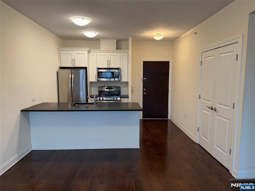 **FIRST MONTH FREE on a 13-month lease + one parking space included! - for occupancy commencing on or before 4/1/26!** Hello, 225 Walker St! At this desirable location in Cliffside Park, you are minutes away from public transportation options [to NYC] as well as routes that lead to main roads and highways to navigate throughout what New Jersey has to offer! Spacious 1-bedroom + 1-bathroom apartment [on TOP FLOOR] with ample living and closet space! Inside this worthwhile apartment, you will find hardwood floors throughout, high ceilings, GE appliances throughout, Kitchen-Aid refrigerator, intercom system, in-unit washer/dryer, as well as attached parking! **PARKING: 1st space INCLUDED IN THE RENT(!); Additional space - $125/monthly!** 225 Walker St is pet friendly (lb limit + fees apply)! REDUCED rent security deposit offered to qualified applicants! Tenant is responsible for ALL utilities! Move-in fee applies! Virtual tour available upon request!!