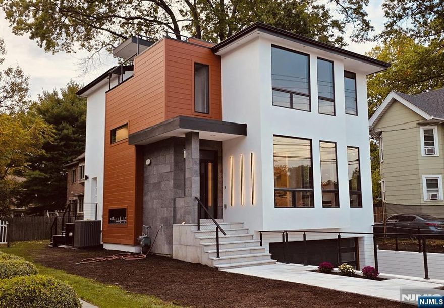 NEW CONSTRUCTION!!! Welcome to 43 Grove St. easy access to NJ Transit for a smooth commute to New York City. 4 en-suites & 2 - car garage with epoxy floors. A level of quality and custom design that is seldom seen in estate homes, built perfectly by developer, NISSI GROUP, LLC. HOME LIKE NO OTHER!!! This one of a kind incredible home leaves nothing TO BE DESIRED beautifully finished with all TOP of the line quality materials. This home will meet all your expectations and more. You enter the FOYER, you'll know that you're seeing something special. bedrooms TOP RATED SCHOOLS and grocery stores are within walking distance. 4BRS, 4.5BATHS, ROOFTOP, GENANRATOR, FIRE PLACE, FRENCH DRAIN. Finished lower level offers a bedroom, full bath, summer kitchen, side entrance door. Ceiling: 10' & 9' IT'S ALL COMPLETED, AND READY TO MOVE IN.