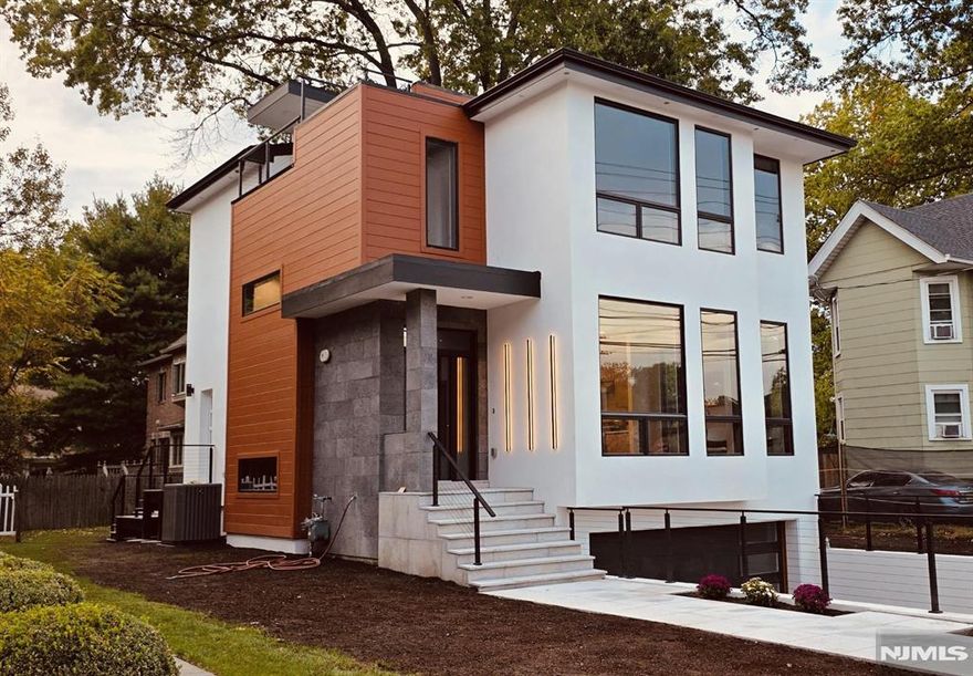 NEW CONSTRUCTION!!! Welcome to 43 Grove St. easy access to NJ Transit for a smooth commute to New York City. 4 en-suites & 2 - car garage with epoxy floors. A level of quality and custom design that is seldom seen in estate homes, built perfectly by developer, NISSI GROUP, LLC. HOME LIKE NO OTHER!!! This one of a kind incredible home leaves nothing TO BE DESIRED beautifully finished with all TOP of the line quality materials. This home will meet all your expectations and more. You enter the FOYER, you'll know that you're seeing something special. bedrooms TOP RATED SCHOOLS and grocery stores are within walking distance. 4BRS, 4.5BATHS, ROOFTOP, GENANRATOR, FIRE PLACE, FRENCH DRAIN. Finished lower level offers a bedroom, full bath, summer kitchen, side entrance door. Ceiling: 10' & 9' IT'S ALL COMPLETED, AND READY TO MOVE IN.