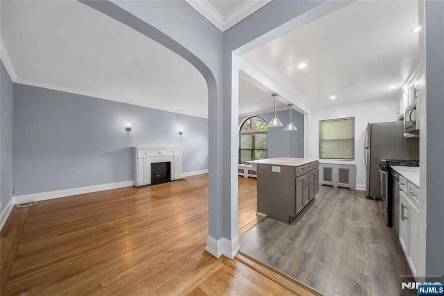 Welcome to Chester Tracey Garden Apartments, ideally situated in the prime East Hill of Englewood. This beautifully renovated, open-concept 1-bedroom, 1-bath apartment is tucked away in a quiet, garden-lined setting, offering both charm and convenience. The unit features refinished hardwood floors, a renovated full bath, a cozy decorative fireplace, and a fully equipped kitchen with newer appliances. Freshly painted throughout, this residence is bright and ready for immediate move-in. Heat, hot water, water, and one assigned outdoor parking space are included in the rent. The tenant is responsible for gas and electricity. Coin-operated laundry is available on-site for added convenience. Located just minutes from Englewood's vibrant downtown, NJ Transit bus service to NYC, parks, dining, and shopping. Tenant is responsible for $125 CCO fee.