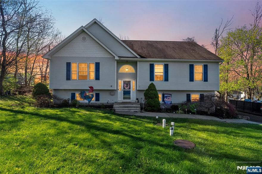 Welcome to this Bi-level home located in the desirable Upper Greenwood Lake section of West Milford. Offering 3 spacious bedrooms 2.5 bathrooms and a bonus room to with what you please, this home provides a comfortable layout ideal for everyday living and entertaining. Step inside to find recessed lighting throughout, complemented by a mix of tile flooring and natural light. The eat-in kitchen features lots of cabinetry, a center island, and ample space for casual dining, while a separate formal dining room adds flexibility for gatherings and special occasions. The inviting family room is highlighted by a cozy pellet stove, creating the perfect atmosphere during cooler months. All bedrooms are equipped with ceiling fans for added comfort. The finished basement offers additional living space, perfect for a recreation room, home office, or guest area. Outside, enjoy a spacious deck overlooking the forested property with fenced in areas. Additional features include a 2-car oversized attached garage and a large driveway providing plenty of parking. Conveniently located with easy access to Upper Greenwood Lake, Warwick NY, Pennings Orchard and so much more. This home offers a great opportunity to enjoy both comfort and outdoor living.