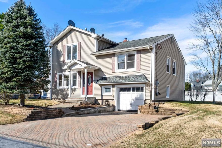 Beautifully updated and expanded, 4 bedroom 2.5 bath split level home situated on a quiet street in the much sought after town of Northvale. Entering the home through the lovely entrance to flowing into the formal living and dining room with French doors leading to an absolutely wonderful kitchen. A kitchen suitable for a gourmet chef with sparkling stainless appliances, a large center island with a prep sink, polished granite counter tops and even a handsome breakfast nook to enjoy the results of your efforts. A short flight of steps brings you to two bedrooms and a full bath. Travel a little further and we find the large principal bedroom suite enhanced by a spa-like bath and walk-in closet and additional bedroom and sitting area with a skylight. Amenities abound from multi zone heating and central air, an attached garage with a brick paved driveway. Northvale, a town known for excellent schools and strong sense of community, easy access to shopping and public transportation.