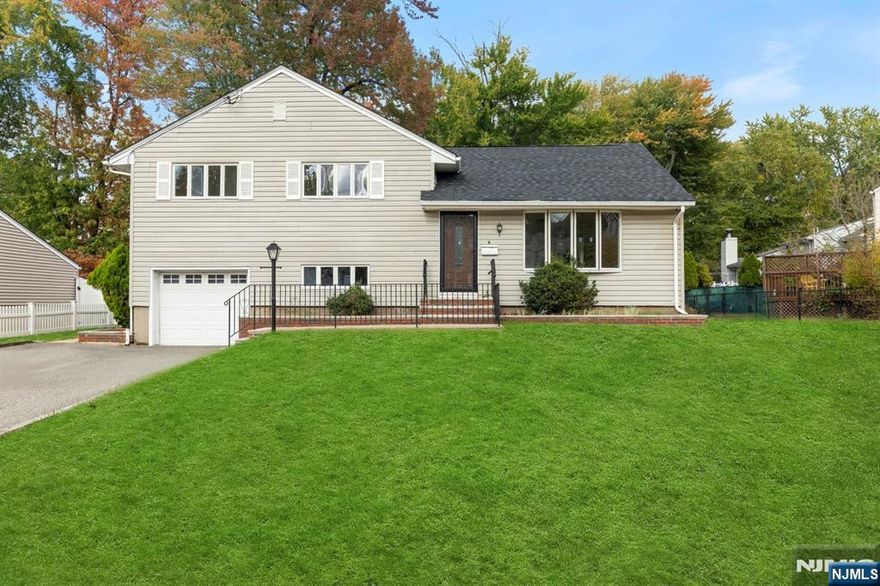 This sun-drenched split-level home in lively Little Falls offers a perfect mix of style and convenience. Step into a bright, open layout with a spacious living room that flows into the dining area and a stunning eat-in kitchen featuring skylights, large windows, and sliders that open to a private deck filling the space with natural light. The main bedroom includes two closets and a half bath, while the impressive flex room can easily become a luxurious suite or creative haven. Enjoy a new roof, refreshed bathrooms, 4-car driveway, and 1-car garage. The homeâ€™s location is unbeatable, just minutes to the train station, NYC bus, Routes 46 & 80, Willowbrook Mall, Home Depot Totowa, great dining, and well-rated schools. A rare find that combines modern updates, sunlit spaces, and commuter-friendly living in one of North Jerseyâ€™s most connected towns.