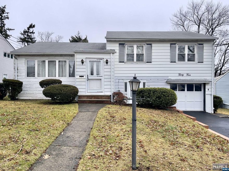 This is your chance to get into the Albion section of town. Bring your imagination and your contractor to this 3 Bedroom, 2 Bath Split Level home situated on a spacious lot in a quiet tree-lined neighborhood. The layout is spacious and perfect for a renovation and/or addition. Unique layout with a large family room in the rear of the home, a basement and 2nd entrance to the ground floor. Hardwood floors are under all carpets on the 1st floor (excluding the Family Room) and the 2nd floor. Less than 2 miles to major highways and Express bus into NYC.