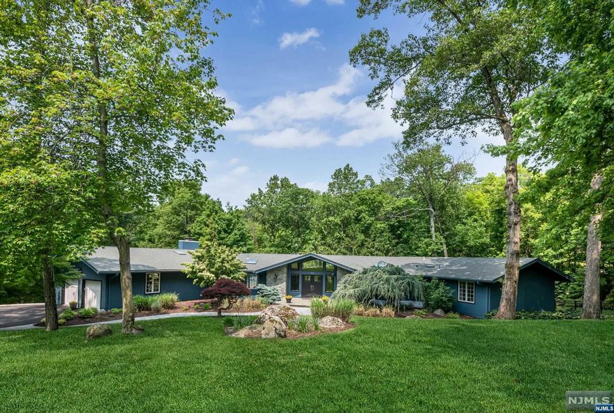 Peaceful living awaits you at 422 Saddle Back Trail in Winton Gate. Escape to your own private oasis and enjoy private country living in this impeccably maintained home in idyllic Franklin Lakes. Tucked away on 1.86 acres of lush, professionally designed and manicured grounds, this 5 bedroom, 3 and 1/2 bath sprawling custom Ranch displays a work of landscape art through the windows in every room. Approx 6,800 sq.ft. of living space between the main and lower levels. The entire property was thoughtfully designed to create a perpetual balance between indoor and outdoor living and entertaining. From the open main level with chef's kitchen and expansive family room, to the well appointed lower level featuring a billiards/game room, wet bar and full walk out to a secluded and tranquil in-ground salt water pool. The lower level also allows for multi-generational living with a bedroom and private living areas for an Au pair, house guests or parents. Welcome Home