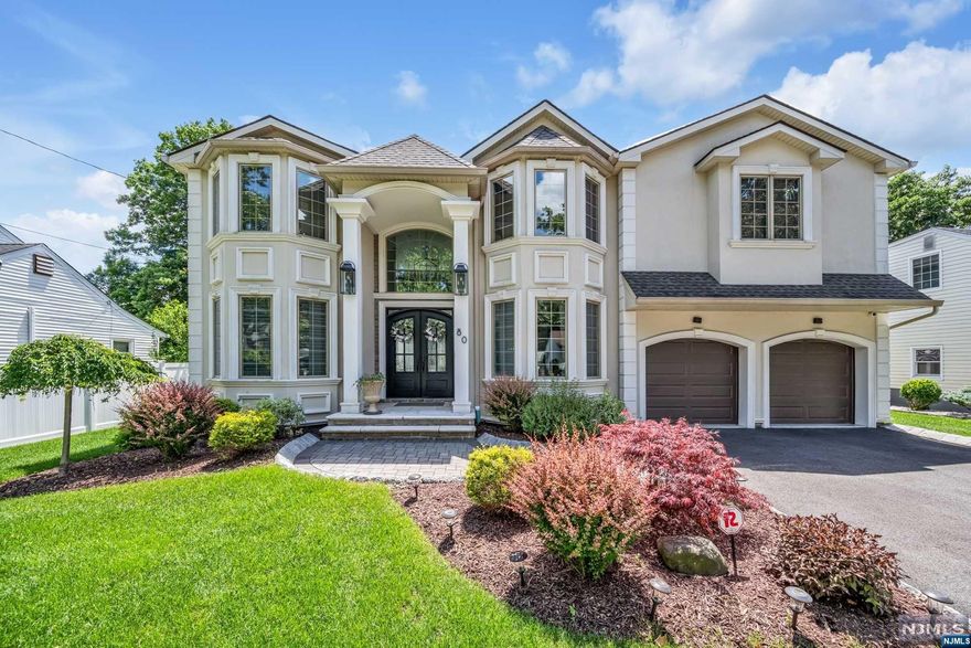 Spectacular newer build in prime Paramus location! Stunning inside & out with beautiful curb appeal. Classic center-hall colonial layout featuring 4 bedrooms, 3.5 bathrooms, and a fully finished basement. Double height entrance foyer greets you immediately. Dining room & home office on either side of the foyer. Continue along to double height family room which is open-concept to the gourmet kitchen with luxury SS appliances and huge center island. Mudroom, half-bathroom, and access to 2 car garage complete the main level. Upstairs, find 4 spacious bedrooms & laundry room. Luxurious Primary Suite with custom double walk-in-closets and spa-like bath with soaking tub, glass shower, and double vanity. Fully finished basement offers huge rec room, bonus room, and bathroom. Beautiful backyard that is fully fenced-in with paver patio. Paramus is home to low taxes, excellent school system, and plenty of amazing shopping.