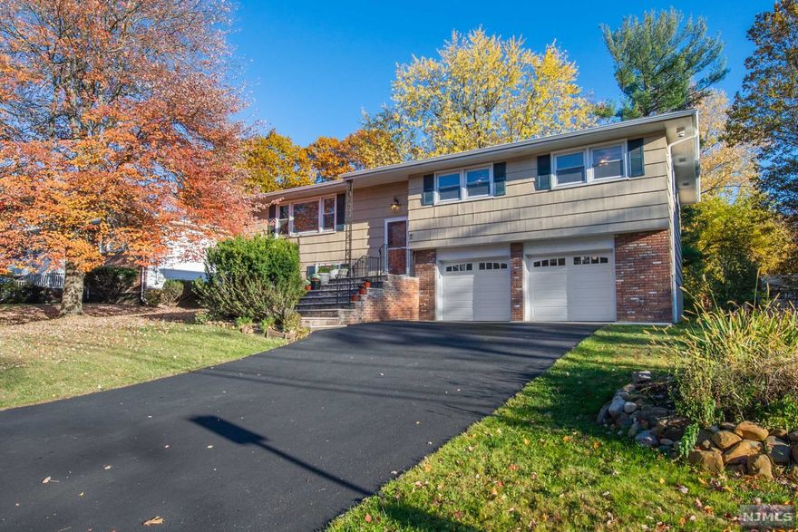 Absolutely fabulous 4 bedroom 3 bath home 2176 sq ft on beautiful level lot perfectly located off Rt 10 close to everything.Spacious rooms freshly painted,refinished hardwd flrs,this lg comfortable home welcomes its new buyers.Light & bright w/updated kitchen new SS gas range & new SS refrig. .Wood cabinets provide lots of storage,great counter space & access to huge open deck right off kitchen.Formal DR,Spacious LR w/hardwd floors & huge picture window. 1st floor includes 3 BR includ. MBR & 2 full baths. Each rm has spacious closets w/a WIC & full bath in MBR. Lower lvl has huge 4th bedrm/office & spacious FR w/ sliding glass door access to patio/backyd.C/A and Whole House Fan. The ground flr has a full bath,laundry rm & access to 2 car huge oversize garage w/lots of extra storage.Can be used for extended family or inlaw suite.Huge level lot & lg patio off FR.Easy commute to NYC via jitney to S Org Train or park/ride at S Mtn Arena.Close to schools,shopping,Restaurants