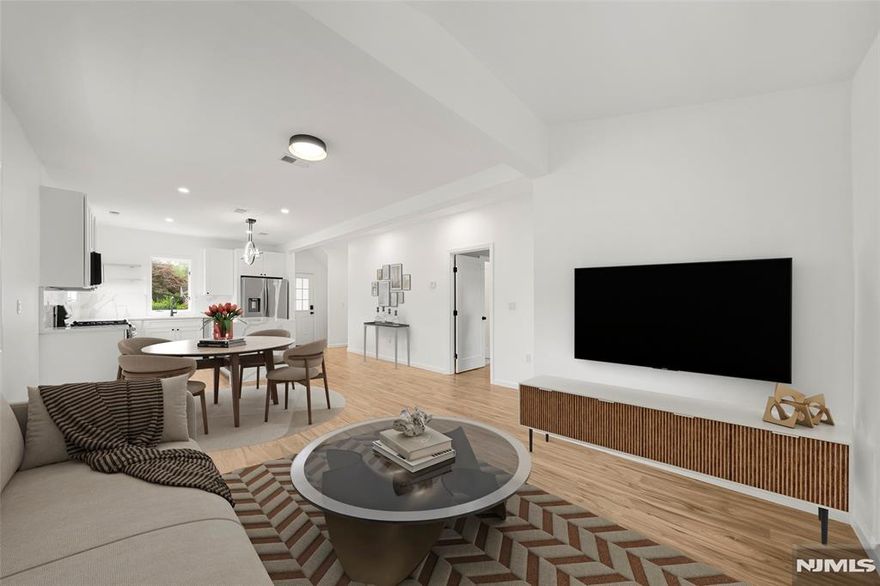 Welcome to 174 Pleasant Ave in Bergenfield! Discover modern living in this fully and exceptionally renovated 4 bedroom, 3.5 bath gem nestled in a highly sought-after neighborhood of Bergenfield, right on the Tenafly border near the Knickerbocker Country Club Golf Course! Designed for comfort & convenience, this sun-drenched home features open-concept first floor with a spacious living/dining area and a chef's kitchen boasting quartz countertops, center island and stainless steel appliances! The main level also offers a welcoming foyer, powder room, coat closet, and a serene master suite with a private bath and direct access to the back deck. Upstairs, you will find two generously sized, light-filled bedrooms, a full bath, and access to attic storage. Fully finished basement offers a finished private setup with a bedroom featuring walk-in closet, a full bath, a kitchenette, laundry room and separate entrance, making it ideal for guests or extended family. Additional highlights include a 6-car driveway, a charming front deck and full CCTV security system(receiver, storage, and subscription-free cloud access). This move-in ready home delivers exceptional value package of style, functionality and peace of mind! Pictures- virtually staged. Don't wait to see this rare gem!