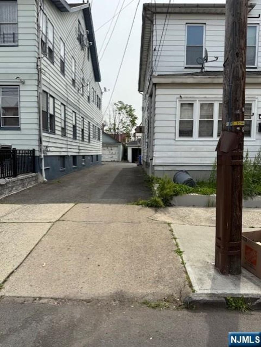 Handyman special!!. Located in the north ward of Newark, 1/2 duplex (right side only). Make this your home-sweet-home. Formal L/R,D/R, eat -in-kitchen, enclosed porch. Detached garage. Low taxes. Second floor features 3 bedrooms and main bathroom. SOLD STRICTLY AS IS, WHERE IS. Most of the windows have been replaced, except the ones on the front porch. Seller is accepting conventional, cash offers, and renovation loans only.