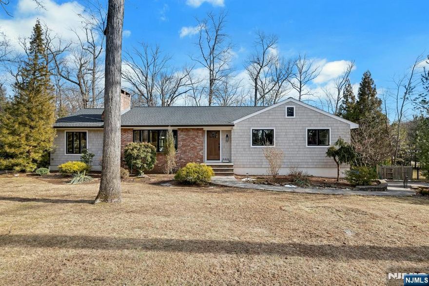 Immerse yourself in the allure of this beautifully renovated ranch, just a short 15-mile drive from NYC and surrounded by top-rated schools in NJ! Discover the impressive upgrades in this stunning home, where modern comfort meets classic charm. Situated in a desirable neighborhood, this property boasts a brand-new roof, top-of-the-line Marvin windows, and Nucedar stylish siding, all completed within the last year, making it move-in ready and worry-free. Enter into the spacious living room that beckons you to unwind by the cozy fireplace. The family room also offers its own fireplace, enhancing the inviting atmosphere and providing perfect spaces for relaxation and entertaining. The chef-inspired kitchen is a culinary haven, featuring elegant cabinets and essential appliances to ignite your culinary creativity. A standout feature of this residence is the seamless flow from the family room to a sunlit den, adorned with three walls of windows flooding the space with natural light. This den could also easily be converted to a 4th bedroom. This area extends to a generous deck, ideal for hosting gatherings or enjoying tranquil outdoor moments. Direct deck access from the primary bedroom further enhances the home's seamless layout. With 3 bedrooms, 2 baths, and a den with the potential to convert into a 4th bedroom, with a fully finished basement featuring chic porcelain floors and laundry room, this home is designed to meet your lifestyle requirements.
