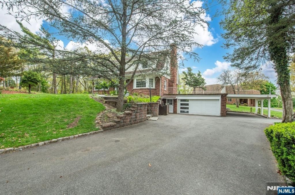 Photo of 839 Rifle Camp Road, Woodland Park, NJ 07424 (MLS # 26016822)