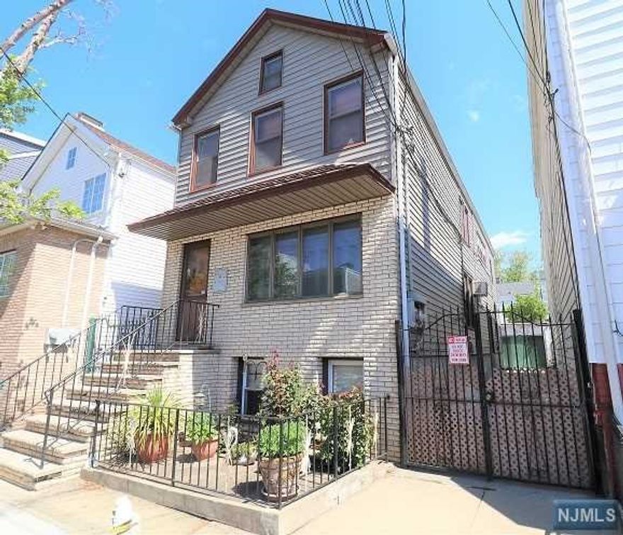 Location, location, location! Well maintained two family home with driveway and garage. This unique multi-family home gives you the best of ALL worlds in the desirable IRONBOUND! Located just five short blocks Penn station, where's a 20 minute train ride will have you in NYC! Ironbound restaurant/ shopping/nightlife and Independence Park. Features first floor modern kitchen, living room and two bedrooms, second floor modern kitchen living room two bedrooms, and has central air A/C. Finished basement with a full bath.