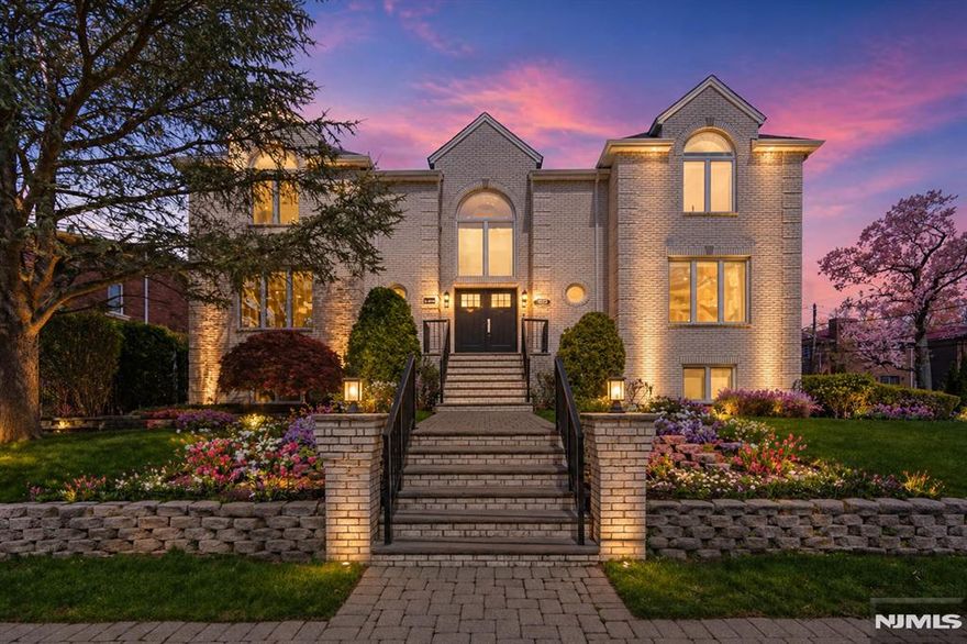 1221 Fairmount Place presents a renovated Colonial residence in Fort Leeâ€™s desirable Bluffs section, offering a refined layout, updated finishes, and convenient access to one of Bergen Countyâ€™s most established residential neighborhoods. The home opens with a two-story foyer and a bright, open main level designed for comfortable everyday living and entertaining. The kitchen is a central feature, appointed with an oversized quartz waterfall island, custom tile backsplash, and high-end stainless steel appliances, including Wolf and Sub-Zero. Sliding doors extend the living space to a raised deck overlooking the backyard, creating an easy connection between the interior and outdoor areas. The second level includes the primary suite along with three additional bedrooms. The primary suite features dual walk-in closets and a well-appointed bath with double vanities, a bidet, glass-enclosed shower, and freestanding soaking tub. The finished lower level adds valuable flexible space with a recreation room, office or bedroom option, full bath, and access to a heated three-car garage. Set within Fort Leeâ€™s Bluffs neighborhood, 1221 Fairmount Place offers a strong combination of space, function, and location near local parks, shopping, dining, major highways, and convenient access to New York City. The virtual tour link provides additional info: https://newjerseyproper.com/mls-1221-fairmount-pl-fort-lee-nj/