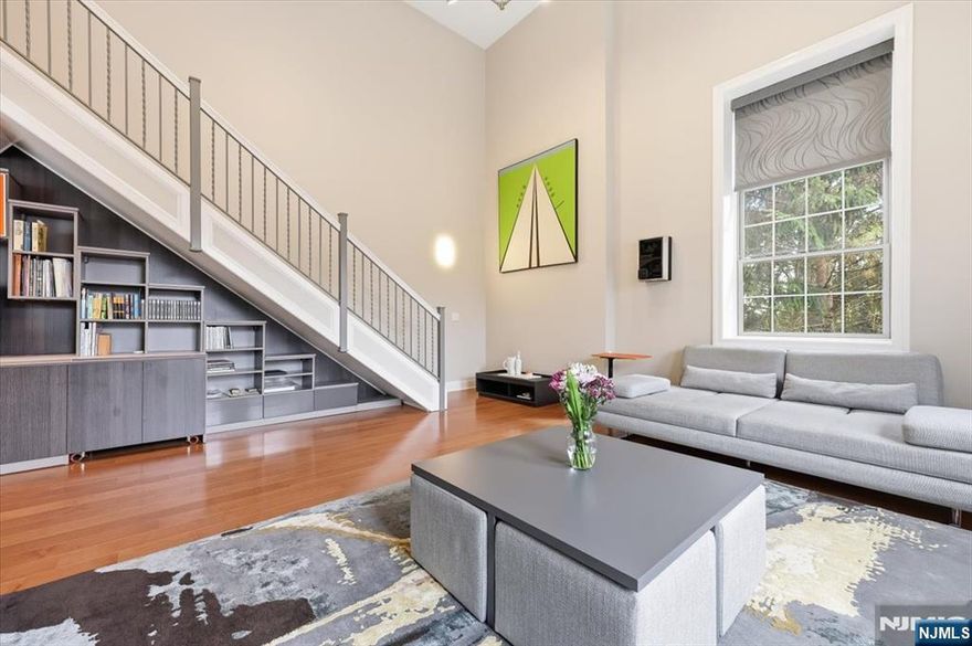 Opportunities like this simply do not come along at Walsh Hall â€” a one-of-a-kind loft-style two-story duplex that redefines luxury condominium living in one of Bergen County's most coveted private communities. Over 1600 sq ft of soaring double-height ceilings command immediate attention, flooded with natural light through oversized windows with motorized shades, a living canvas of elegance impossible to replicate in a standard unit. Every finish reflects an uncompromising vision. The custom Porcelanosa kitchen pairs seamlessly with a Wolf microwave drawer, Sub-Zero refrigerator, and Miele range and dishwasher, a true chef's suite. The California Closet library/office transforms everyday living into something inspired. Custom electric parquet floors run throughout, with Carrara marble concealed beneath, a detail that speaks volumes about how this residence was conceived. The duplex layout delivers privacy and separation of space rarely found within Walsh Hall's 92 residences. With only a handful of units of comparable footprint ever offered in the building's history, this is a true unicorn in the inventory. Beyond the front door, Rio Vista's world-class amenities including fitness center, saunas, outdoor pool, formal gardens, tennis and pickleball courts, set within 466 acres of rolling hills at the foot of the Ramapo Mountains, complete an unmatched lifestyle. Refined living at its most effortless.