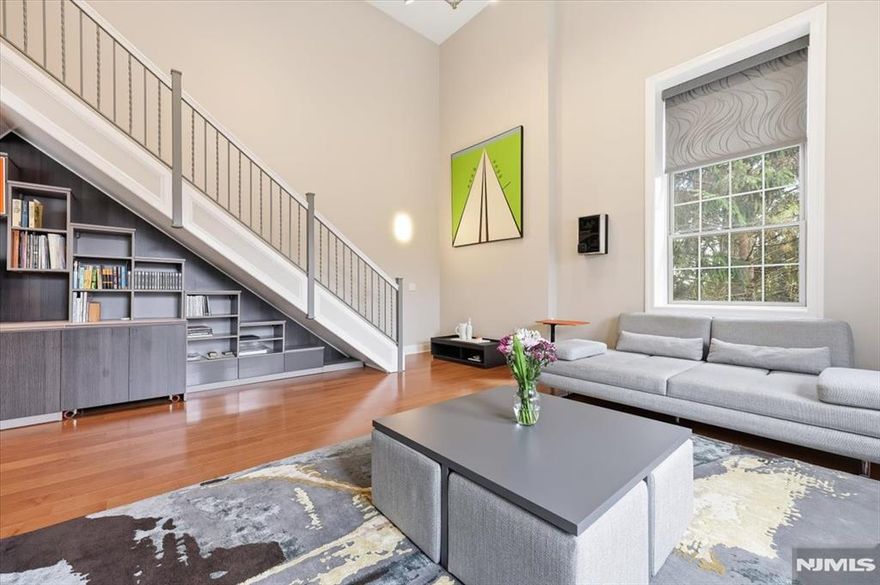 Opportunities like this simply do not come along at Walsh Hall â€” a one-of-a-kind loft-style two-story duplex that redefines luxury condominium living in one of Bergen County's most coveted private communities. Over 1600 sq ft of soaring double-height ceilings command immediate attention, flooded with natural light through oversized windows with motorized shades, a living canvas of elegance impossible to replicate in a standard unit. Every finish reflects an uncompromising vision. The custom Porcelanosa kitchen pairs seamlessly with a Wolf microwave drawer, Sub-Zero refrigerator, and Miele range and dishwasher, a true chef's suite. The California Closet library/office transforms everyday living into something inspired. Custom electric parquet floors run throughout, with Carrara marble concealed beneath, a detail that speaks volumes about how this residence was conceived. The duplex layout delivers privacy and separation of space rarely found within Walsh Hall's 92 residences. With only a handful of units of comparable footprint ever offered in the building's history, this is a true unicorn in the inventory. Beyond the front door, Rio Vista's world-class amenities including fitness center, saunas, outdoor pool, formal gardens, tennis and pickleball courts, set within 466 acres of rolling hills at the foot of the Ramapo Mountains, complete an unmatched lifestyle. Refined living at its most effortless.