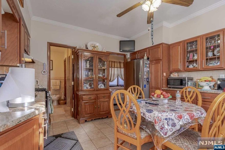 Colonial home in good condition with finished basement, utility room. Property is on a double lot 50x100 parking for 10 cars. Property being sold with lot 695 North 8th st.