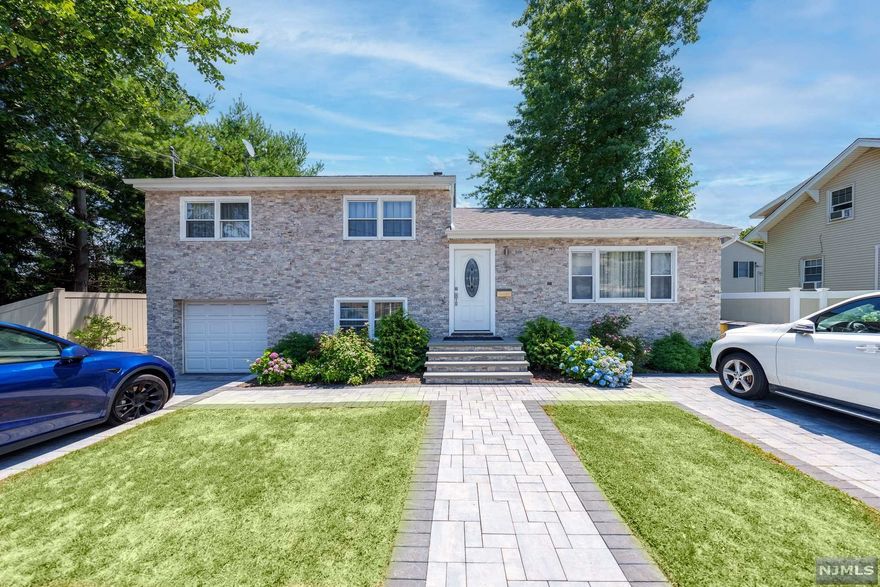 Welcome to 412 Rochelle Ave. This beautiful split-level sits on a large 60x 150 lot. The home features 3 bedrooms, 2 full baths, living room, dining room, kitchen, fully finished basement with a bar, den/office area, attached 1-car garage, and 4-car driveway parking. The immense backyard has an outdoor living area, a patio and a firepit. The house was fully renovated in 2019. Radiator/ Baseboard Heat/Central AC(2019), New Water Heater (2022), French Drain, sump pump (both 2019) and NOT IN FLOOD. Conveniently located near schools, shopping, public transportation, & major highways.