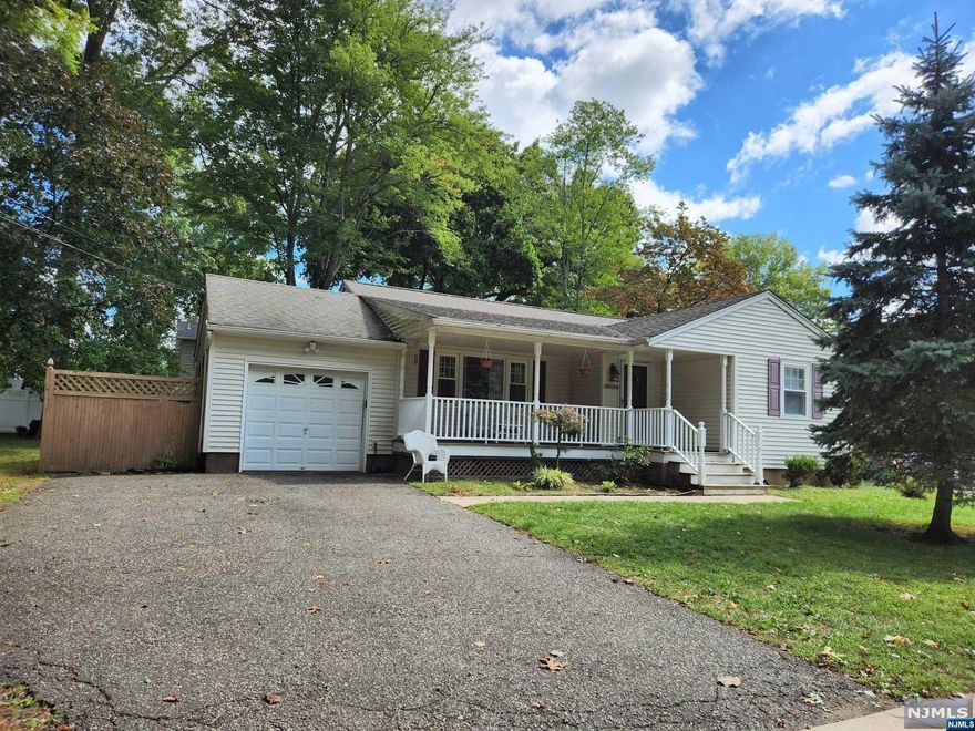A charming, open front porch welcomes you to this 3 Bedroom Ranch. Tucked away on a quiet street, near a dead end, it's situated on a 100x100 corner lot. This home has so much potential and lots to love including the lemonade front porch, formal living room & dining area, updated kitchen, vinyl replacement windows, vinyl siding, 1 car garage, 200 amp electric & central Air. Make this home your own by painting, refinishing the existing hardwood floors, etc. Home is in decent shape, but shall be sold in complete as-is condition