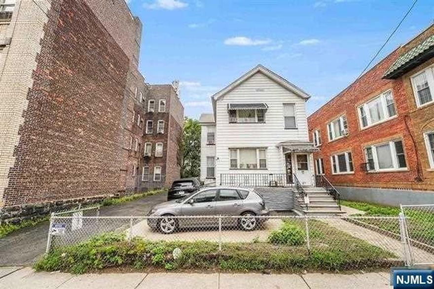 Discover a multitude of opportunities on this expansive 50X107 lot, perfect for crafting a four-story masterpiece, all thanks to the advantageous zoning regulations in place.This property entices you with its allure and potential, inviting you to envision converting it into an eight (or more) unit dwelling. Bring along your architect and your aspirations. Nestled on one of the most coveted streets in the Heights, residents appreciate the proximity to acclaimed dining establishments such as Corto and Bread & Salt. Riverview Fisk Park, offering breathtaking views of NYC and a vibrant farmer's market, is just a stone's throw away. Moreover, convenient access to New York City is at your fingertips with the Light Rail station just a quick 3-minute stroll away, and the NJ Transit bus stopping right outside your front door.