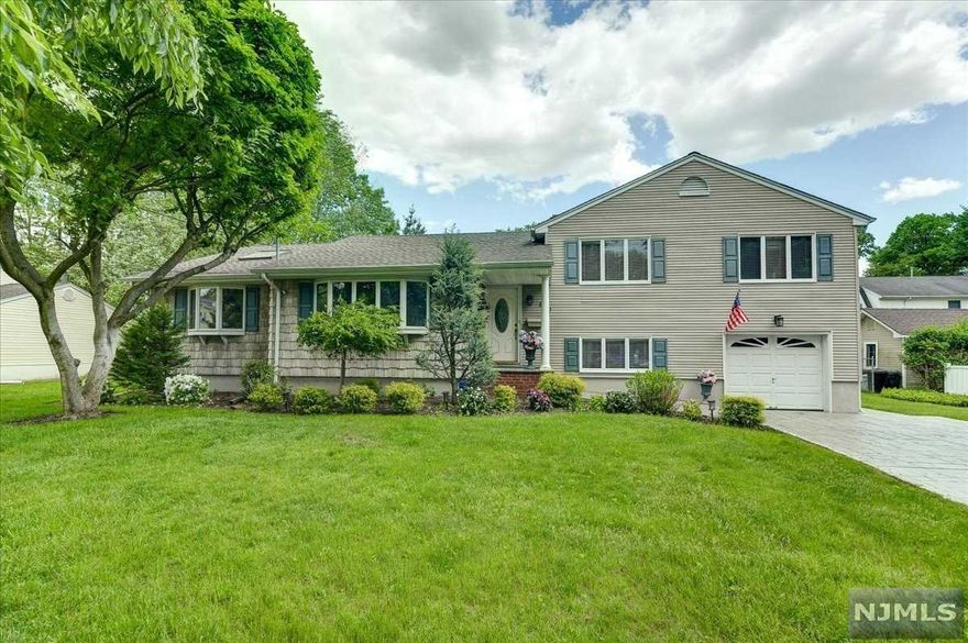 This 3 bedroom 2.5 bath split level on a dead end street, is what you have been waiting for. A covered front entry way leads you to an inviting entry that opens to the large living room. The living room opens into the dining room, and into the updated kitchen with tile floor and backsplash, granite counter tops, recessed lighting, and stainless steel appliances. The main level also boasts a large family room with skylights, full bath, and walk in closet, that was once the master bedroom and could be converted back! Upstairs find three bedrooms with ceiling fans, full updated bath, and linen closet. Downstairs is another family room/office space, with 1/2 bath, access to the oversized attached garage and backyard access to the covered patio. Special features include in ground sprinklers, gas grill hook up, 200 amp electric, new furnace, 5 year old washer/dryer, Anderson windows, and a double wide stamped concrete driveway. **HIGHEST AND BEST BY 5PM TUES 5/24