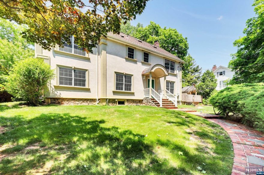 Welcome to one of the most special houses in River Edge. Very bright and sunny, at least 3500 ft 4bed,3.5 bath, upon entering find the spacious layout -open living room with fireplace, family room w/fireplace. Vaulted ceilings, Dining room plus eat in custom made kitchen w/island, plenty of counter and storage and leads to a private backyard and paver driveway. The 1st floor offers 2 additional rooms which can be bedrooms/home offices/den with full bath THAT CAN BE UTILIZED AS AN IN-LAW/GUEST SUITE, side entrance, laundry room. The 2nd floor has a primary bedroom suite complete w/ jacuzzi & stall shower and 2 more spacious bedrooms and full bath. Additional features include finished attic. It can be used as a playroom or additional bedroom. Hardwood floors and all bright rooms. Unfinished basement with high ceilings. HOME WAS RENOVATED IN 2010 AND 2018.Excellent schools. conveniently located to major highways, close to transportation to NYC, shopping, restaurants so much more...