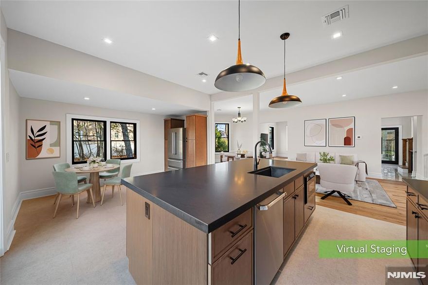 * Presented by Wendy Gamez 917-540-3347 * Exquisite transitional Victorian masterfully renovated to deliver the ultimate blend of historic elegance and contemporary luxury. This 5BD/2.5BA residence showcases all-new systems, high-end finishes, and superior craftsmanship throughout. Grand 9.5â€™ ceilings, wide-plank European oak floors, radiant-heated main level, and custom millwork create a warm yet sophisticated ambiance. The open, sun-filled layout is designed for seamless living and effortless entertaining. A chefâ€™s kitchen anchors the home with Bertazzoni S&S appliances, granite countertops, marble backsplash, custom cabinetry, and direct access to a Trex deck overlooking a tranquil backyard retreat. The primary suite features a spa-caliber bath and expansive closet space, while three additional bedrooms offer versatility for guests, workspace, or a fitness studio. The fully finished walk-out basement provides flexible living with a bedroom and a recreation/media lounge. Notable upgrades include Pella Lifestyle windows, new electric and plumbing, spray foam insulation, central vacuum, 3-zone AC, 5-zone heating, sprinkler system, and insulated solid-iron entry. Multi-car parking. Convenient to shops, parks, dining, and NYC transit. Low taxes: $13,425(approximately). A turnkey residence delivering timeless architecture with elevated modern living.