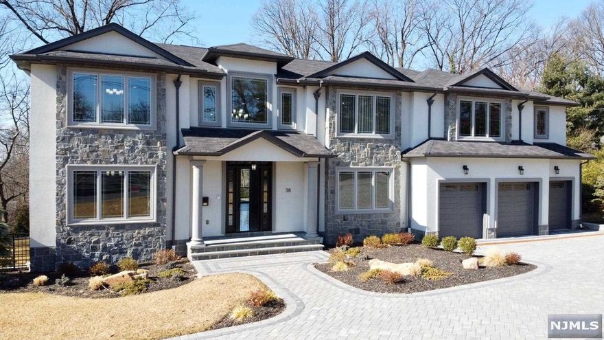 BETTER THAN NEW - COMPLETED IN 2020, SUNNY AND BRIGHT, EXCLUSIVE CENTER HALL COLONIAL ON TENAFLY'S PRESTIGIOUS EAST HILL LARGE LOT; top of the line luxurious finishes throughout; 6 bedrooms including grand Master Suit with opulent Master Bathroom and six and a half designer bathrooms. Custom made kitchen with top of the line appliances and Scavolini cabinets, large formal dining room, two story entry foyer with marble floors and two story large great room with fireplace. Beautifully finished walkout basement with lounge area and fire place, wine cellar, gym/yoga room, extra bedroom w full bath and a bar. Resort style large private backyard with salt water pool and hot tub, fire pit and separate sitting area. 3 car heated garage. Renowned Blue Ribbon Tenafly schools, low property taxes. Builder's warranty. THIS EXCLUSIVE HOUSE IN THE BEST LOCATION OF TENAFLY IS NOT TO BE MISSED!