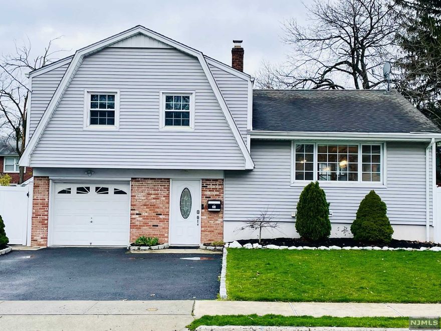 This is the one you have been looking for. Recently renovated a stunning & spacious sugar maple split on a dead end street in a wonderful part of town. This 3Br, 2Bth home has many updates and is bright and modern. Enter into a spacious entry foyer that leads to double doors into the family room /home office with a full bath. Another set of double doors leads you to the spacious fenced back yard with a patio w/ motorized awning, new lawn and playset. The open concept first floor with living room, dining room and a modern kitchen that features high end appliances, granite tops w/ breakfast nook. Large size Master Bedroom with 2 closets and access to full bath. 2 more bedrooms complete on that level. The basement is finished with a rec room, laundry room & utility room. Additional features: Central Air & Heat, Nest Thermostat, Smart multi zone sprinkler system, hardwood floors throughout and ample storage. Close to school, NYC transportation, house of worship