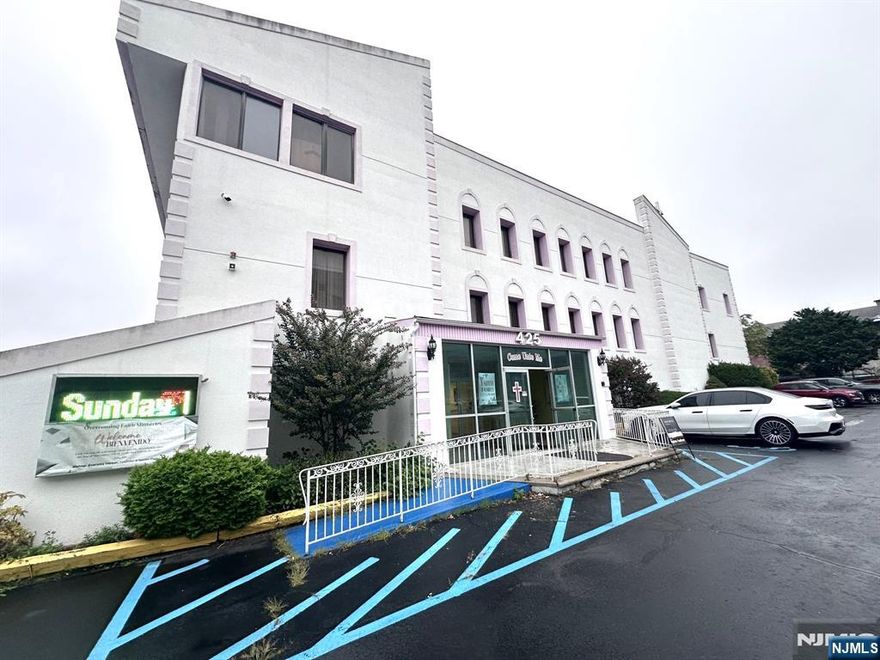 Modern style building zoned for special purposes on over half an acre. Features 80 parking spaces in fenced in area. Separate office building included in sale. 32 pews accommodating 340. Raised platform for choir and parishioner. Baptismal pool and changing room. Multi levels with offices, kitchen, full sized dining area and passenger elevator. Loading dock