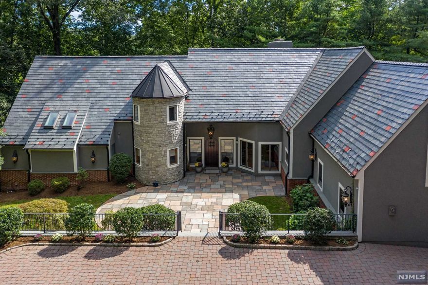 UPDATED CALIFORNIA MODERN RETREAT W/SPACIOUS,BRIGHT ROOMS.STUNNING PRIVATE OASIS W/OVER 1.5 ACRES ON ONE OF RIDGEWOOD'S MOST VALUED STREETS.ARCHITECTURAL DESIGNER OWNED IT'S A PERFECT COMBINATION OF OPEN CONCEPT W/SEPARATE SPACE/PRIVACY FOR THE ENTIRE FAMILY. FULLY RENOVATED EXTERIOR/5 BEDROOMS/5.5 BATHS/OVER 6100 SQ FEET OF FAMILY LIVING. EXQUISITE FIRST FLOOR PRIMARY SUITE W/ENORMOUS BATHRM FEATURED IN SEVERAL MAGAZINES. ADJACENT BEDRM/OFFICE LEADS TO LR/DR/FAM RM W/SOARING FIREPLACES AND CATHEDRAL CEILINGS. BRIGHT UPDATED MEIK FOR EASY ENTERTAINING OPENS TO DECK/PATIO AND FREE-FORM HEATED POOL. 2ND FLR HAS 3 GRAND BEDROOMS. AND 3 FULL BTHS.WALK OUT FINISHED REC ROOM W/GLASS DOORS TO BACKYARD, FBATH, BEDRM/OFFICE,STORAGE. 2 SEPARATE YARDS:FLAT SPORTS/PLAY AREA AND BEAUTIFUL, SECLUDED POOL W/CABANA. NEVER SHOVEL OR PLOW AGAIN! HEATED PAVER DRIVEWAY. RARELY, A HOME THIS SECLUDED AND SERENE AND SO CONVENIENTLY LOCATED TO NYC TRAIN/DOWNTOWN SHOPS/RIDGE SCHOOL BECOMES AVAILABLE!