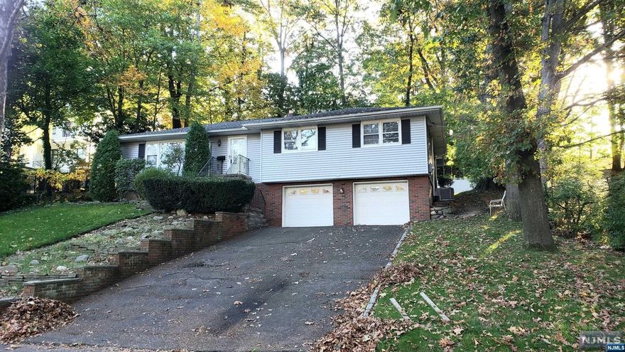 Prepare to fall in Love with the potential for this Ranch-style home! Great opportunity to live in Desirable Paramus on a landscaped lot with Backyard Deck and 2-Car Garage. The main floor features convenient one-level living with a well-sized eat-in Kitchen, Living Room, Dining Room, 3 Bedrooms with closets, and 2 full Baths. Downstairs, there is a finished basement with laundry and access to the 2 car garage. Bring your contractor and your ideas!