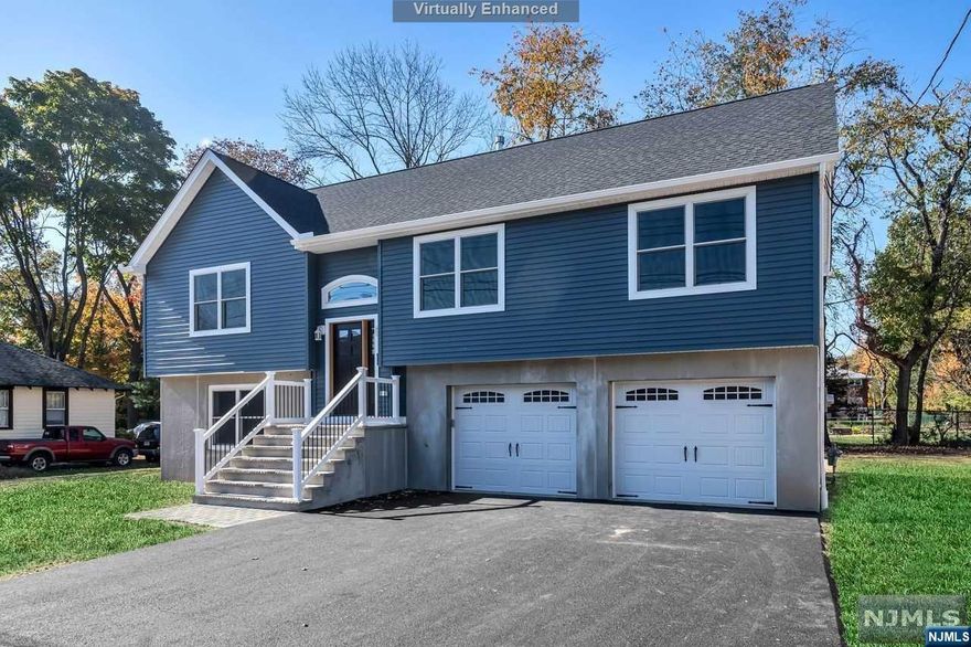 ALL BRAND NEW CONSTRUCTION! NOT Builder Grade! See for yourself - Gorgeous Bi-level. Stunning kitchen w/Samsung SS app., refrig under cabinet lights, recessed lights throughout the home, center island w/electric, soft close custom cabinets, Porcelain tile backsplash compliments Quartz counter tops. SGD to deck w/PVC railing & aluminum spindles. Open Concept LR, DR & Kitch. Large Master BR w/FB walk-in shower. Another FB with tub and two ample sized bedrooms. Ceiling fans with lights in all bedrooms. Beautiful wood floors throughout main level! Ground level has huge L-shaped FR w/Luxury Vinyl Plank flooring & SGD with walkout to paver patio under deck & large rear yard, partially fenced. 3rd FB w/ shower, laundry/utility room.CAC, Energy Eff Hat, indirect HWH, 200 AMP. Near Rt 287, NYC express P&R a few miles away, NYC bus on corner. Taxes do not reflect adjusted amount. New Home Bldrs Warranty. Inside rails/step to be stained.