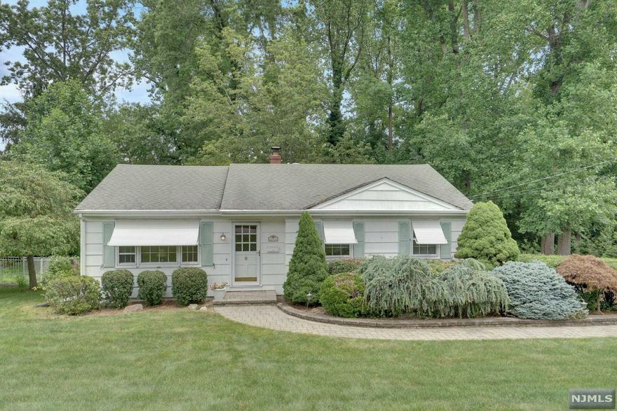 IDYLLIC LIVING! Light & Bright! This Charming Ranch is perched on Lush, Professionally Landscaped Property set on Quiet Cul-de-Sac. Natural Light imbues every room and highlights the gorgeous hardwood floors. Renovated Eat-in-Kitchen complete with Pantry. Enjoy a Spacious Master Bedroom + 2 additional Bedrooms. 1 Full Bath, a Finished Lower Level that features a Fabulous Family Room & Den with a walkout to yard. Sun-Drenched spacious Deck is an unbeatable feature. Workshop, Attached Garage, Central Air and so much potential! Big Time Opportunity! Being Sold 'AS IS.' Call Today.