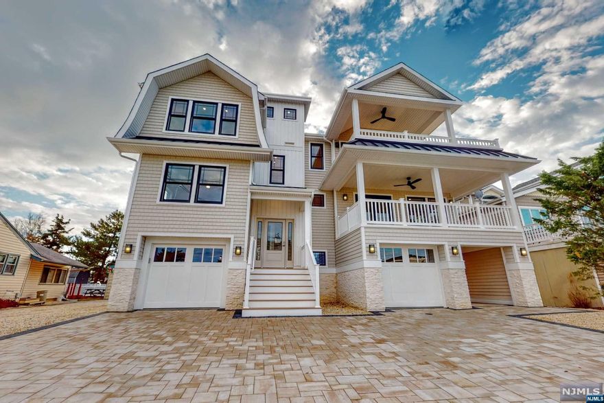 Premier Builder of LBI offering a Craig Brearley designed 2023 New Construction 2,784.74 Sq. Ft. on an oversized lot. Short walk to the beach, restaurants and stores. GE Monogram 48" Refrigerator and Commercial Grade Stove with Island, 5 Bedrooms (Possible 6th Bedroom), 3.5 Baths, Gas Fireplace with shiplap surround and Ceramic Tile, 3 Stop Elevator, Rooftop Deck, Two Covered Porches with Ceiling Fans, Oversized Heated Saltwater Pool, Outdoor Kitchen, natural gas fire bowl and Paver Patio, Black Anderson 400 Windows, Certainteed Cedar Impressions, Paver Driveway and Breezeway, Outdoor Shower, Finished Garage ideal for Additional Entertaining. Good fit and finish and every element of the home is accurately aligned, precisely spaced, and appropriately fastened. A short walk to the Ship Bottom Municipal Boat Ramp to launch all of your water crafts. Don't Miss Out On This Opportunity For Personal Use or Investment! *Seller holds a NJ Real Estate License
