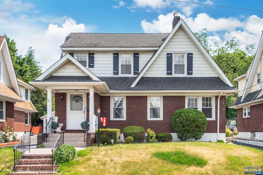 Charming colonial home built by renowned builder, Roughgarden, with spacious double lot backyard, finished basement, walk-up attic, and 2-car garage. Nestled within a desirable block with a stately row of homes featuring columned front porches generating noticeable curb appeal. The first floor offers a cozy living room w/your very own fireplace. The living room opens to an elegant formal dining room, an office, eat-in-kitchen & a convenient half bath. Off of the dining room is an all-seasons room with large windows displaying the double lot-sized backyard and letting in plenty of sunlight. Upstairs, you'll find the 3 bedrooms & a full bathroom that includes both a spacious, bench-seat shower and a bathtub. This property also boasts a long driveway and a two-car garage for your convenience. The interior of the home features hardwood flooring and original wood trim amplifying its timeless appeal. Ample storage space throughout, including the finished basement & walk-up attic.