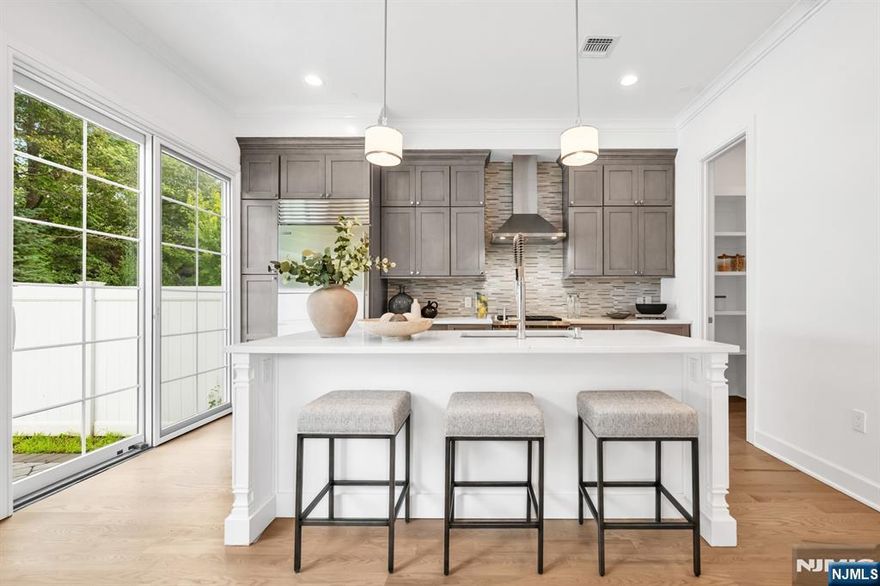 Stunning luxury townhome at Gabriel Estates, a boutique community in the heart of Paramus. Built just a few years ago, this exceptional residence was upgraded to include a rare in-unit private elevator servicing all three levels. The home offers 3 bedrooms, 2 full bathrooms, and 2 half bathrooms, with soaring 10-ft ceilings on the first floor and 9-ft ceilings upstairs, creating an open and airy flow. The gourmet chefâ€™s kitchen is a showpiece, featuring chic cabinetry, Sub-Zero/Wolf appliances, quartz countertops, and sliding glass doors that open to a private backyard. The impressive primary suite includes a spacious walk-in closet and a spa-like bathroom with a soaking tub, large shower, and double vanity. The fully finished lower level expands the living space with a fabulous recreation room and custom wet bar with beverage center, perfect for entertaining. Enjoy outdoor dining and relaxation with the serene patio and fenced yard. All of this just minutes from the Garden State Parkway, Route 17, world-class shopping (Trader Joeâ€™s, Whole Foods, Garden State Plaza, Shake Shack, Container Store, Crate & Barrel, and more), plus access to Paramusâ€™ top-rated schools.