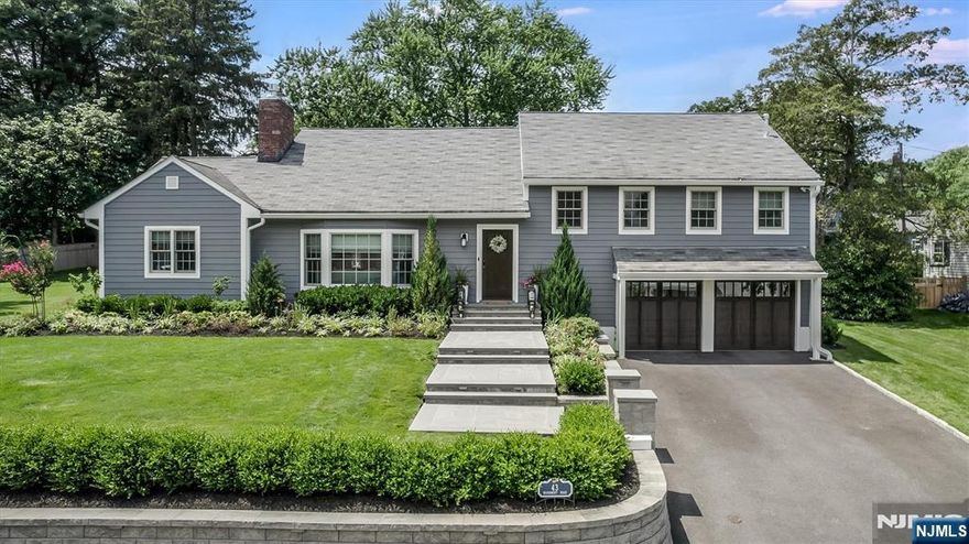 Welcome to 43 Woodmont Road in Upper Montclair a showstopping, top-to-bottom renovation on nearly half an acre, just four houses from Yantacaw Park and a short stroll to Brookdale and Tuers Parks. Every inch of this home has been upgraded with intention and high-end design, inside and out there's truly nothing to do but move in and enjoy this spectacular home in a prime location. The kitchen is a chef's dream with quartz waterfall island, farm sink, and high-end stainless appliances overlooking a beautifully landscaped, fenced backyard retreat. Entertain in style with a Trex deck with retractable canopy and lighting, paver patio with gas fire pit, outdoor kitchen with built-in BBQ and fridge, plus a Sport Court basketball court. The full interior renovation includes the kitchen, bathrooms, designer lighting and wallpaper, custom closets, Smart Home features with Nest controls, and a gas fireplace. Two bedrooms feature en-suite baths, and the layout offers both open flow and cozy spaces. All new Andersen windows, doors, Everlast siding, and bluestone walkways. Finished garage with epoxy floors, new garage doors with built-in cameras. Generator, new 2-zone HVAC, full security system, irrigation, and new sewer line round out this fully turn-key home in an unbeatable location just minutes to NYC train, bus, parks, and vibrant Uptown Montclair.