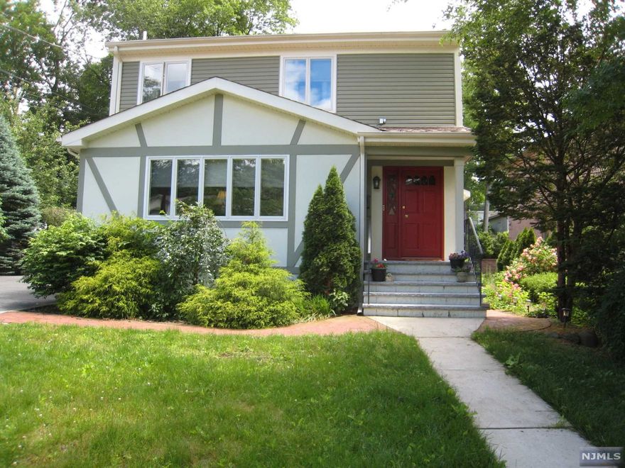 ***INCREDIBLE OPPORTUNITY IN RIDGEWOOD***OWNER OCCUPIED OR IDEAL RENTAL PROPERTY***WELCOMING PORCH ENTRY-WONDERFUL TOP/ BOTTOM HOME w/ SEPARATE ENTRANCES-SPACIOUS LIVING RM-KITCHEN HAS GORGEOUS CABINETS/ GRANITE COUNTER TOPS/ TILED BACKSPLASH/ STAINLESS APPLIANCES/ TILED FLOOR- BEAUTIFULLY RENOVATED TILED BATHS-GENEROUS BEDROOMS OR OFFICE SPACE w/AMPLE CLOSETS-HARDWOOD FLOORS-PRIVATE REAR PAVER PATIO w/ GRILLING AREA-DETACHED 2 CAR GARAGE PLUS STORAGE-ENOUGH PARKING FOR 6 CARS- CLOSE TO VILLAGE/ SCHOOLS/ PARKS/ SHOPPING / TRAIN-NOTHING TO DO BUT MOVE IN OR COLLECT RENT FROM CURRENT TENANTS***A-MUST-SEE!!!***