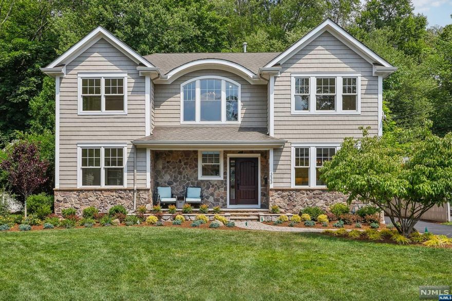 Newly remodeled masterpiece by Wennersten Builders. Designed by architect Jordan Rosenberg and constructed in 2007, this custom-built colonial features 4 bedrooms, 3 fully-renovated baths, and is ideally situated on a double cul-de-sac. Enter the 2-story foyer to discover an energized, freshly painted interior with refinished hardwood floors, all-new lighting, and modern upgrades throughout. The open floor plan is perfect for entertaining, with 9' ceilings throughout, tall windows, raised panel wainscoting, modern eat-in kitchen with new appliances and quartz countertops and family room with fireplace & custom mantle. Also on 1st floor are a designated home office, convenient bedroom, and full bath. Upstairs, the luxurious primary bedroom retreat offers a tray ceiling, a custom walk-in closet, laundry nook and a spa-like bath. New landscaping, rejuvenated porch & patio, heated garage, and adjacent to pristine town-owned Green acres & Saddle River bike path!