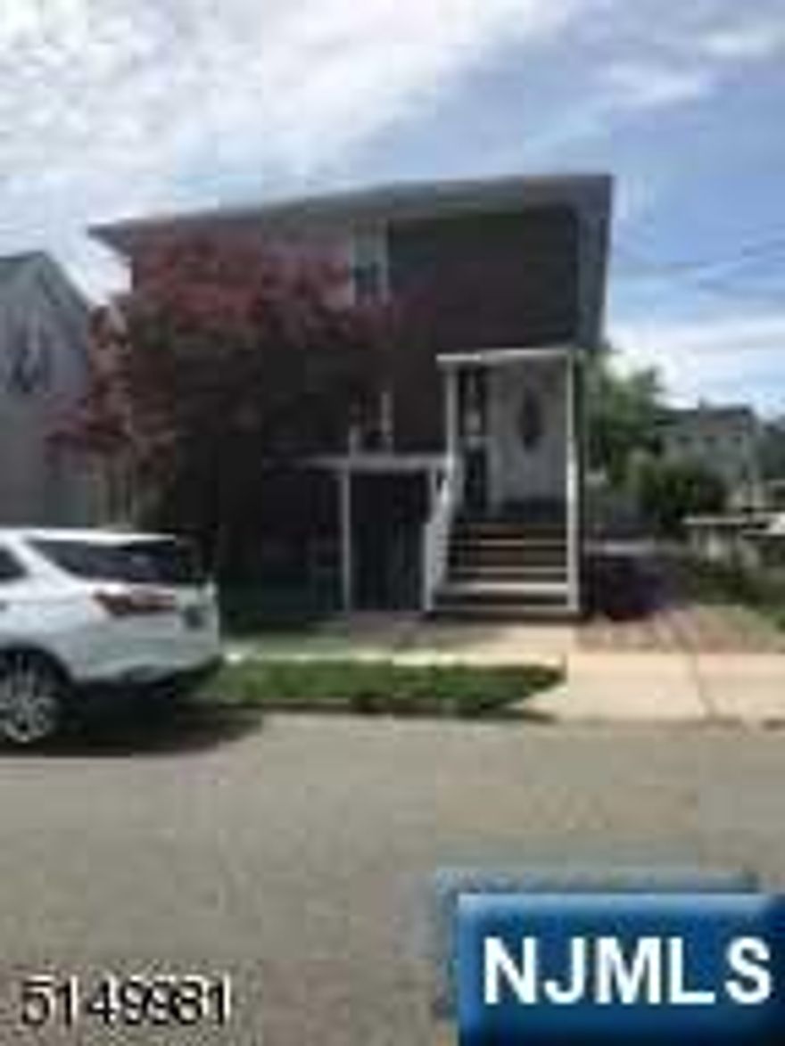 CUSTOM BUILT "BRICK" Home, First and Second Floors are the same (LR,DR,Eat in Kitcen,2 Bedrms, Tile Bathrm.) BASE:Finished THREE Rms,Sep. Exterior Entrance, Half Bath, HARDWOOD Flrs, Sep.Gas Heat, QUALITY HOME