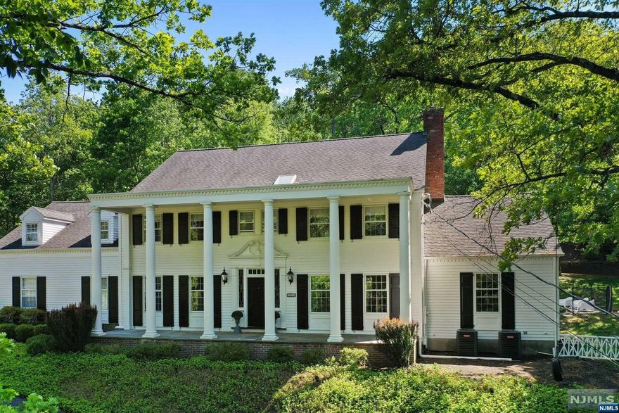 Welcome to your dream home surrounded by a private oasis of 1.93 acres of splendid nature, with gunite swimming pool, tennis courts and paved patio for indulging & entertaining with family & friends. This exquisite Greek Revival home stands tall with elegant architecture, stately columns & stunning lake views offering tranquility & luxurious living at its finest. Upon entering, the foyer sets the stage for the spacious sun drenched living areas and adjacent rooms: Fdr/Lr/Fp, Chefs Kit with top of the line appl's/ample counter space, BrkfRm, Fmr/Fp with floor to ceiling sliding glass doors, bonus screened patio, office & Hb. On the 2nd Fl, retreat to your primary suite with Mb & oversized walk-in closet, add'l four Br's/3rd Ba provide plenty of space. Located in the desirable South Gate Urban Farms section of Franklin Lakes enjoy access to NYC transportation, shopping, Indian Trail Club, Market Basket, golfing, tennis, restaurants, equestrian riding center, and top notch schools.