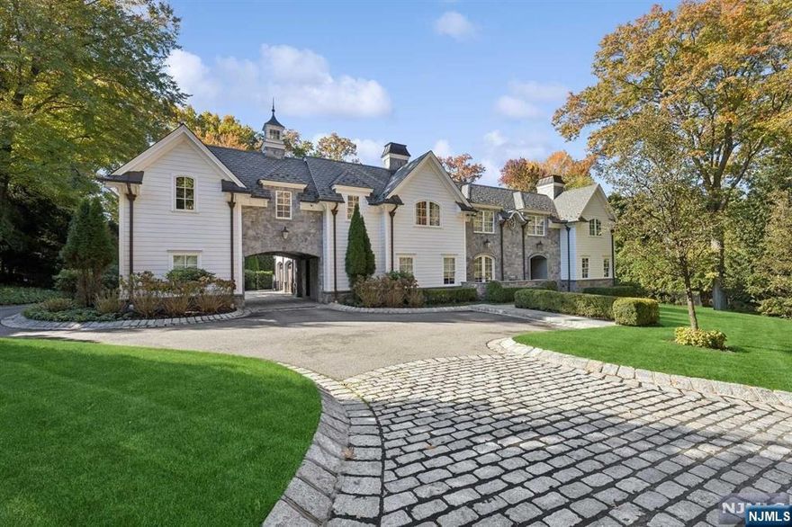 BEST LOCATION IN DEMAREST! SENSATIONAL, CHARISMATIC, FLAWLESSLY EXECUTED STONE & HARDY PLANK TRANSITIONAL COLONIAL WITH PORTE-COCHERE. 7 BEDROOM SUITES! FRONT TO REAR FOYER WITH HARDWOOD FLOORS OPENING TO AN ALL-SEASON STONE FAMILY ROOM WITH FIREPLACE AND AUTOMATIC SCREENS FOR EASY INDOOR AND OUTDOOR LIVING. LARGE LIVING ROOM WITH WETBAR, LIBRARY, AND DINING ROOM WITH STONE PORCH. COUNTRY KITCHEN WITH BREAKFAST AREA FEATURING SOUTHERN EXPOSURE. PRIVATE OFFICE ON THE MAIN LEVEL, CHILDRENS TELEVISION/MUD-ROOM AREA, 2 POWDER ROOMS, AND 3 CAR GARAGE ON THE MAIN LEVEL. FRONT AND REAR STAIRCASE.THE PRIMARY SUITE ON THE SECOND FLOOR FEATURES TWO WARDROBE CLOSETS, INCREDIBLE PRIMARY BATH, AND HUGE TERRACE OVERLOOKING THE REAR YARD AND POOL. 5 ADDITIONAL BEDROOM SUITES WITH BATHS. THE LOWER LEVEL IS FULL, FINISHED, WITH HIGH CEILINGS AND INCLUDES A HUGE PLAYROOOM, THEATER, GYM, WINE CLOSET, AND BEDROOM WITH FULL BATH. FULL HOUSE GENERATOR! WELL LANDSCAPED, AND PRIVATE! SHOWS LIKE NEW!!