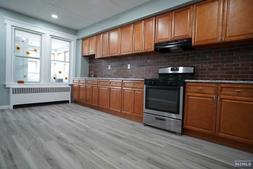 Newly updated 2 family home with separate utilities along with bonus finished attic and finished basement with full bathroom. *****HIGHEST AND BEST TODAY SUNDAY, FEBRUARY 20th AT 7 pm************